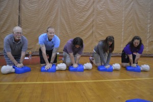 Westfield High School faculty practice proper CPR techniques as part of the Kevs Foundation day to spread awareness of sudden cardiac arrest. Westfield High School, Westfield Middle School North and St. Mary's High School all participated. (Photo by Robby Veronesi)