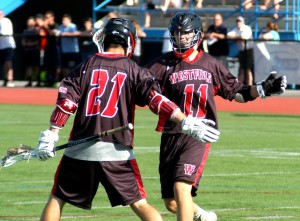 Westfield's Sam Scarfo (21) and Anthony Sullivan (11) celebrate during the 2014 season. The Bombers found good reason to celebrate again Monday. (Photo by Chris Putz)