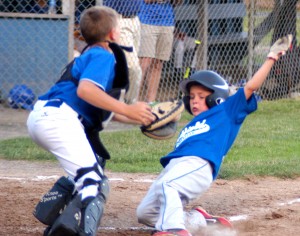 The Westfield Little League Baseball American 10-11-Year-Old All-Stars slide past Southampton to begin their 2014 postseason run.  The city's American and National League 11-12 Year-Old All-Stars open 2015 tournament play Thursday night at their respective home venues. (Photo by Chris Putz)