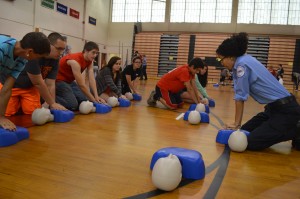 Westfield High School students practice with the assistance of AMR paramedics. (Photo by Robby Veronesi)