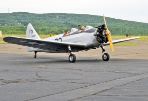 Westfield residents Harland Avezzie and his passenger Melissa Hartman prepare to lift off from Barnes Regional Airport in a World War II PT-23A aircraft. Avezzie is president of the Pioneer Valley Military & Transportation Museum at Barnes Regional Airport. (File photo by Frederick Gore)