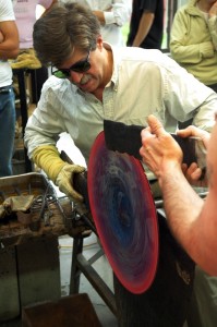 Artist Josh Simpson demonstrates his glass blowing process. 