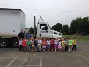 Dan Lawry and Rob Drost of Lawry Freight System recently paid a visit to Ms. Castonguay and Ms. Atwell's preschool classes at St. Thomas School in West Springfield. They were invited guests of Dan's daughter, Marygrace, 5. The children were learning about the different modes of transportation, as well as the importance of safety. (Photo submitted)