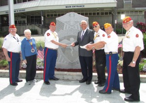 The Marine Corps League, Department of Massachusetts, visited the Soldiers’ Home recently to present checks to the Home’s recreation fund. From left to right: Bob Peloquin, junior vice commander, Westfield River Valley Detachment 141; Ernestine Stowell, retired colonel, U.S. Marine Corps and veteran at the Home; Dan Bishop, commander of the Westfield River Valley Detachment 141; Paul Barabani, superintendent of the Home; Don Rivette, Marine Corps League state liaison to the Soldiers’ Home in Holyoke; John Rutovich, New England Division paymaster for the Marine Corps League; and Francis Curnow, Department of Massachusetts chairman of the Finance Committee. (Photo submitted)