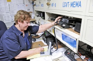 Pauline Dunlap, an amateur radio operator, monitors a bank of ham radios as part of a simulated disaster drill which involved various portions of the United States. (File photo by Frederick Gore)