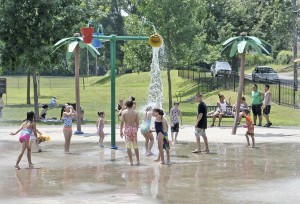 Children of all ages enjoy the spray park at the Municipal Playground Wednesday. (Photo by Frederick Gore)
