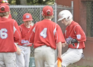 Westfield National Ryan Moorhouse, right, is greeted by his teammates after an over-the-fence homerun against visiting Great Barrington. (Photo by Frederick Gore/www.thewestfieldnews.smugmug.com)