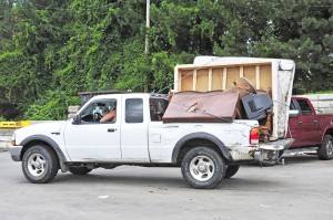 The driver of this pickup truck prepares to unload in the Twiss Street Recycling Center yesterday. (Photo by Frederick Gore)