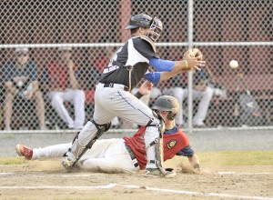 Westfield Post 124 baserunner Colin Dunn slides safely into home as Post 68 catcher Brian Bonacquisti waits for the ball during Monday night's American Legion Baseball tournament game at Bullens Field. (Photo by Frederick Gore)