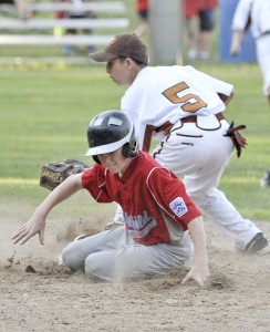 Westfield National's Jack Masciadrelli, foreground, beats the tag at second during last night's game with Agawam. Westfield National went on to win the District 2 championship in a mercy ruled 11-1 game. (Photo by Frederick Gore
