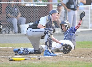 Westfield's Kyle Roberts, right, scores during Friday night's 14-Year-Old Babe Ruth 2014 New England Regional Tournament game against Exeter, New Hampshire at Bullens Field. (Photo by Frederick Gore)