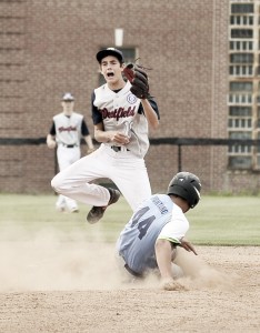 Westfield shortstop Carter Cousins, rear, screams after making the out on Maine baserunner Jason Montano during Tuesday night's game in Newtown, Connecticut. (Photo  by Frederick Gore)