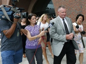 Former Massachusetts state probation commissioner John O'Brien leaves federal court in Boston.  O'Brien, along with two deputies, William Burke and Elizabeth Tavares, were convicted of rigging the agency's hiring process to favor politically-connected candidates over more qualified ones. (AP File Photo/Elise Amendola)