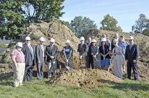 Westfield Mayor Daniel Knapik, center, is flanked by John D. Leary, left, chairman of the Westfield Council on Aging Board of Directors, and Christine 'Tina' Gorman, right, as the three toss a shovel of dirt at the Council on Aging Senior Center groundbreaking crremony at 45 Noble Street Tuesday morning. Also in attendance were state and local officials. (Photo by Frederick Gore)