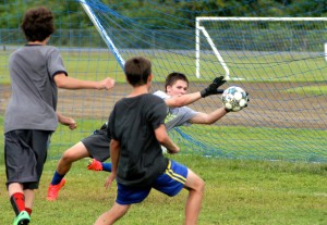 Gateway Regional senior goalie Spencer Rock makes one of several spectacular diving saves during the first day of practice for the boys' soccer team Thursday in Huntington. (Photo by Chris Putz)
