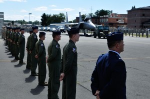 Guardsmen of the 104th Fighter Wing stand at attention as the procession carrying the family of Lt. Col. Morris "Moose" Fontenot, Jr. arrives at the hangar at the Barnes Air National Guard Base yesterday.(Photo: MSgt. Aaron Smith, Public Affairs,  102nd Intelligence Wing) 
