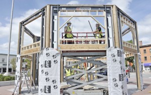Westfield Vocational-Technical High School carpentry instructor Rick LaBay, right, and Garrett Kellam, left, a senior, work on the upper level of the new Park Square Pavilion Wednesday. (Photo by Frederick Gore)