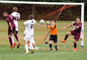 Westfield sophomore Ian Saltmarsh punches the ball away from the Westfield goal in one of his many saves on Monday against Ludlow.  The Bombers defeated the Lions 4-2 after a strong first half, and scoring the first goal. (Photo by: Liam Sheehan)