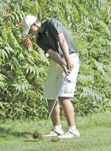 Southwick High School's No. 1 James Longhi chips from the rough during Wednesday's match against Palmer at the Edgewood Country Club. (Photo by Frederick Gore)