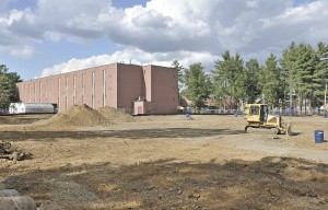 Contractors clear the land where a new science building will be constructed on the Westfield State University campus between Wilson Hall and the Commuter Lot. (Photo by Frederick Gore)