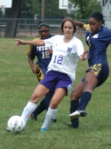 Westfield Voc-Tech's Katie Nesmelova (12) holds of Putnam while dribbling the ball. (Photo by Chris Putz)