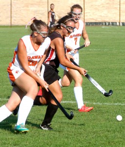 Westfield attempts to split the Agawam defense during a high school field hockey game Friday. (Photo by Chris Putz)