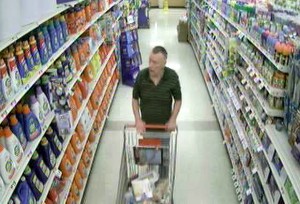 A person who appears to be shoplifting suspect Joseph F. Rego is seen selecting merchandise in a city supermarket. (Photo courtesy Westfield Police Department)