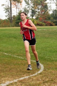 Sophie Gronbeck races to a first-place team finish for Westfield in Tuesday's cross country meet at Minnechaug. (Photo by Kate McCabe)