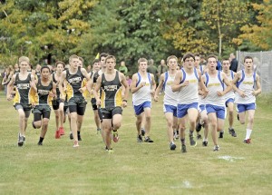 Members of the Gateway and Southwick boys' cross country teams leave the starting line during a meet in Southwick yesterday. The three-mile run had to be redesigned at times to accommodate the construction and renovation projects within the Southwick school complex. (Photo by Frederick Gore)