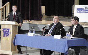 Patrick Berry, left, moderator and owner of The Westfield News Group, questions State Senator Donald Humason Jr., center, and candidate for office Patrick T. Leahy, right, during last night's candidate forum at Westfield Vocational-Technical High School sponsored by The Westfield News Group and the Greater Westfield Chamber of Commerce. (Photo by Frederick Gore)
