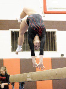 Westfield's Liz Walker completes her balance beam routine for a score of 8.35 during last night's tri-meet with Agawam and Hampshire Regional. (Photo by Frederick Gore)