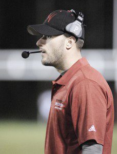 Westfield High School football coach Robert Parent, hired midseason to take over as interim head coach for the Bombers, coaches the team from the sidelines. (Photo by Frederick Gore)