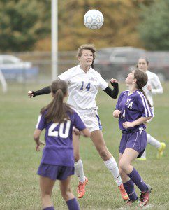 Gateway sophomore Gabby Goralczyk, center, gets the header against Smith Academy. Gateway went on to win 2-0. (Photo by Frederick Gore)