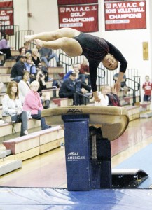 Westfield's Devin Daly completes her vault routine during Thursday night's tri-meet with Chicopee Comp and Hampshire Regional. (Photo by Frederick Gore)