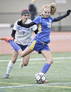 Gateway freshman forward Jessica VanHeynigan , foreground, snags control of the ball as Monson junior Allie Zollo follows during the first half of the 2014 MIAA Div IV West Sectional at Westfield State University. Monson went on to win the title 2-0. (Photo by Frederick Gore)