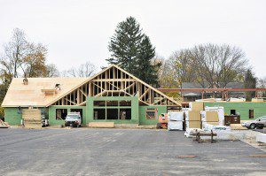 Contractors continue to apply the roof and outdoor structures at the new Westfield Senior Center on Noble Street Friday. (Photo by Frederick Gore)