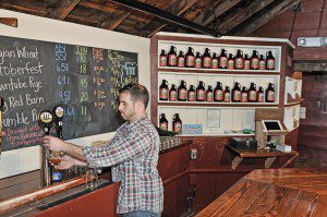 Brewmaster of the Westfield River Brewing Company, Sergio Bonavita, pours one of the newest homemade beers at their new location at 707 College Highway in Southwick. The business is located inside the former Chucks Steak House. (Photo by Frederick Gore)