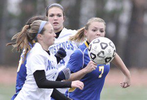 Gateway senior midfielder Caroline Booth, right, battles Monson's Jen Fabrycki and Lauren Libiszewski during the first half of Sunday's MIAA Div IV West Sectional at Westfield State University. Monson went on to win the title 2-0. (Photo by Frederick Gore)