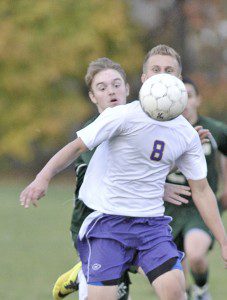 Westfield Voc-Tech's Alex Stepanchuk, foreground, eyes a loose ball as a McCann Tech defender moves in. (Photo by Frederick Gore)
