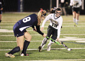 Southwick junior Sydney Rogers, right, battles Frontier Regional's Celia Speth during the first half of Saturday night's West Division 2 Field Hockey Final in West Springfield. Rogers went on to score the Rams only goal. (Photo by Frederick Gore)