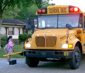 This photo shows a safety arm which is deployed in front of a parked school bus. (Photo by Wikipedia.org)
