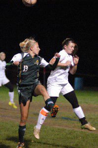 Southwick's Amber Nobbs, left, and a South Hadley player meet during a header. (Photo by Chris Putz)
