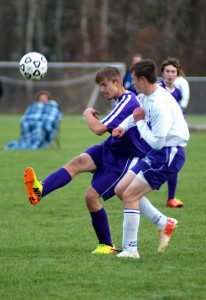 Westfield Voc-Tech (purple jerseys) attempted to kick the ball - and Smith Academy - in a WMass D4 quarterfinal game Friday in Hatfield. (Photo by Chris Putz)