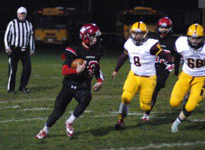 Westfield half back Cody Neidig (39) tries the turn the corner against the Chicopee defense Friday night at Bullens Field. (Photo by Chris Putz)