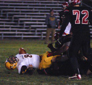 The Westfield defense twists a Chicopee ball carrier to the ground. (Photo by Chris Putz)
