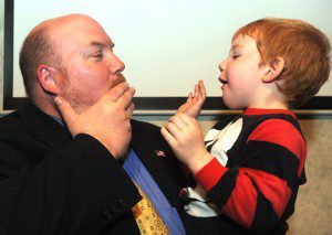 Don Humason plays with his son, Quinn, after speaking to his supports Tuesday evening at East Mountain Country Club. (Photo by Carl E. Hartdegen)