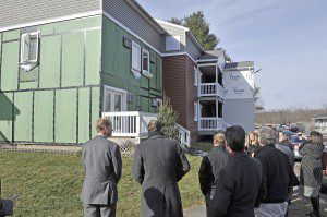 Officials from the U.S. Department of Housing and Urban Development along with Peabody Properties and contractors tour the new $3 million energy efficient upgrades to Powdermill Village in Westfield, Thursday. (Photo by Frederick Gore)