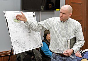 Rob Levesque, of R. Levesque Associates Inc., of Westfield, uses an illustration to show a proposed 11-lot subdivision off Northwest Road during a meeting with members of the Westfield Conservation Commission yesterday. (Photo by Frederick Gore)