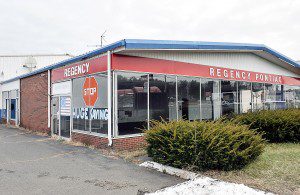 A license petition was submitted by 99 Restaurants of Boston, LLC, which is planning to demolish an automobile dealership, Regency Oldsmobile at 342 East Main St., and construct a new 5,688-square-foot one-story restaurant facility. The chain plans to open the new facility next fall. (Photo by Frederick Gore)