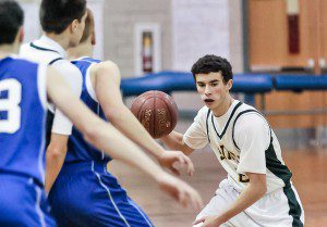 St. Mary's Nick Garde, right, attempts to dribble past a pair of Pioneer Valley Christian Academy defenders during Monday night's game at Westfield Middle School South. (Photo by Frederick Gore)